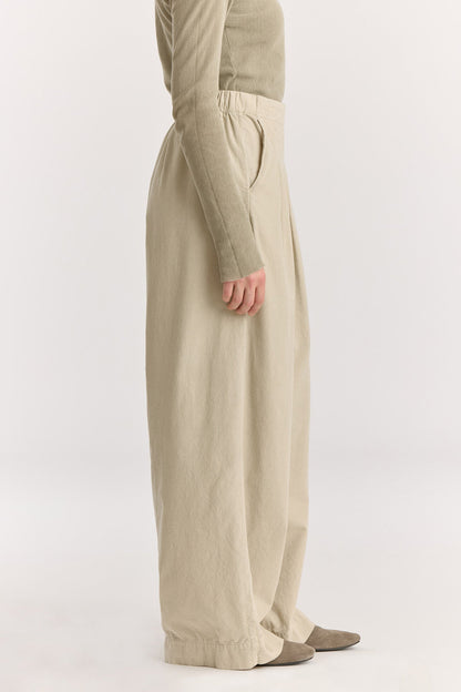 Wide Pleated Pants / Ivory
Elastic waist
Pleated detail at the front
Slash pockets
Wide shape
100% Cotton baby corduroy
Machine wash in cold water, tumble dry low, no bleach
Style number: BC-LWP05
Regular fit
Made in USA
Woman wearing ivory wide-leg baby corduroy pants with front pleats, elastic waistband, and slash pockets.
