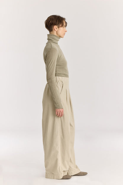 Wide Pleated Pants / Ivory
Elastic waist
Pleated detail at the front
Slash pockets
Wide shape
100% Cotton baby corduroy
Machine wash in cold water, tumble dry low, no bleach
Style number: BC-LWP05
Regular fit
Made in USA
Woman wearing ivory wide-leg baby corduroy pants with front pleats, elastic waistband, and slash pockets.