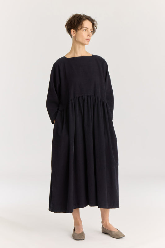 Tradi Dress / Dark Navy
Square neckline with facing
Dolman sleeves&nbsp;
Shirring on front and back for volume bottom
Side seam pockets
100% Cotton baby corduroy
Cold machine or hand wash, tumble dry low or dry flat, no bleach
Style number: BC-TRD01
Relaxed Fit
Made in USA